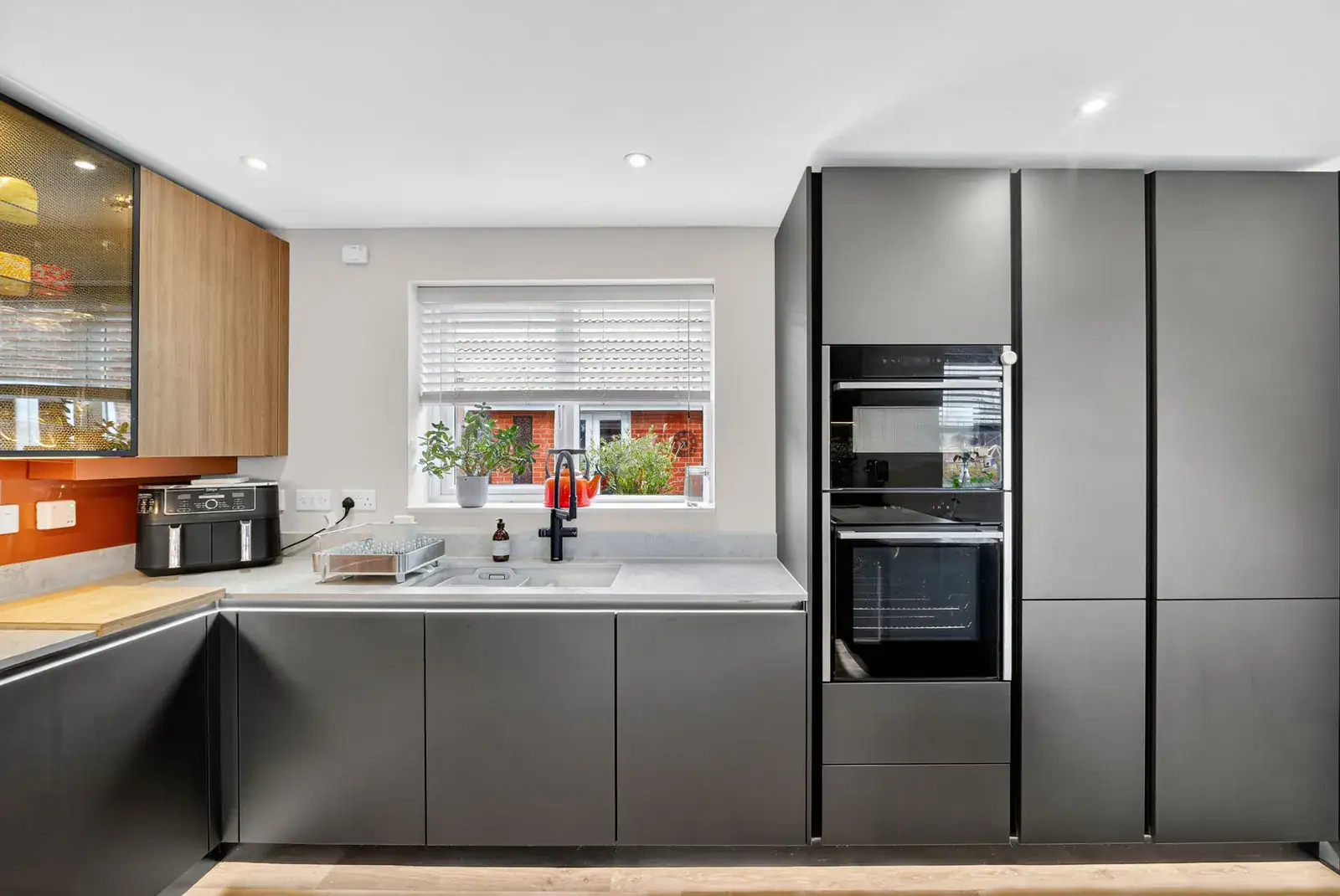 Sleek Handleless Kitchen Case Study designed and installed by House of Harmony