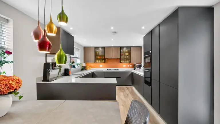 Schuller Kitchen a sleek handleless layout showcased in the Smart Glass door style, designed and installed by House of Harmony