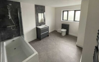 Utopia fitted furniture in Clara door style in English pebble with white carcass Bathroom