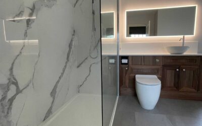 Bathroom installed in Cambridgeshire with Ellis fitted furniture in Walnut and Corian worksurface in salt