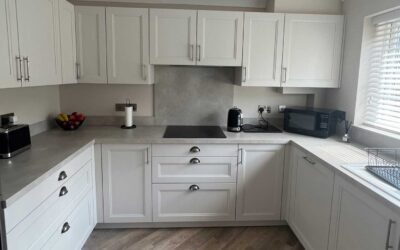 Beautiful Schüller kitchen designed and installed in our Finca Seashell white with lamont cup and bar handles